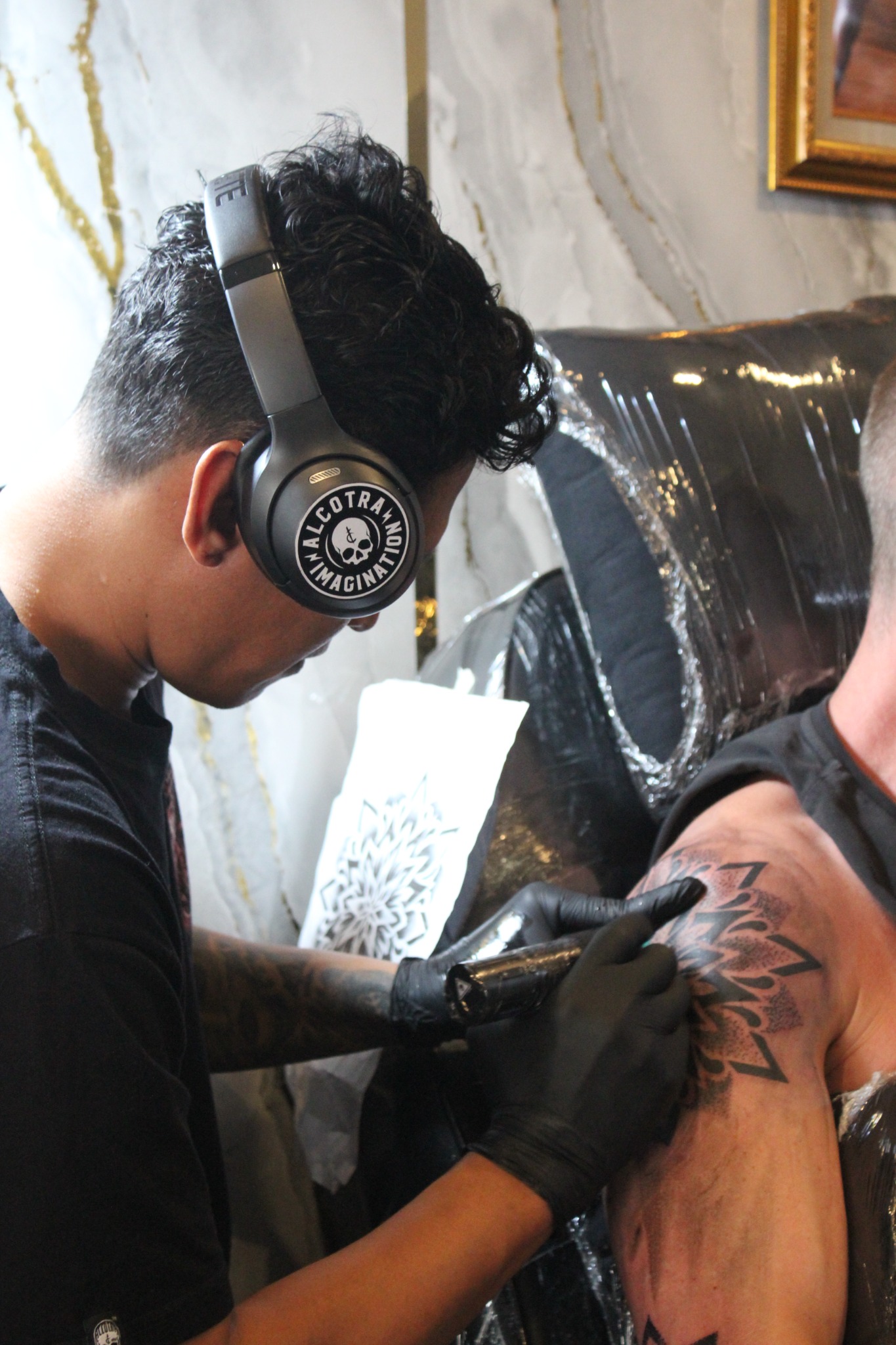 Tattoo artist working